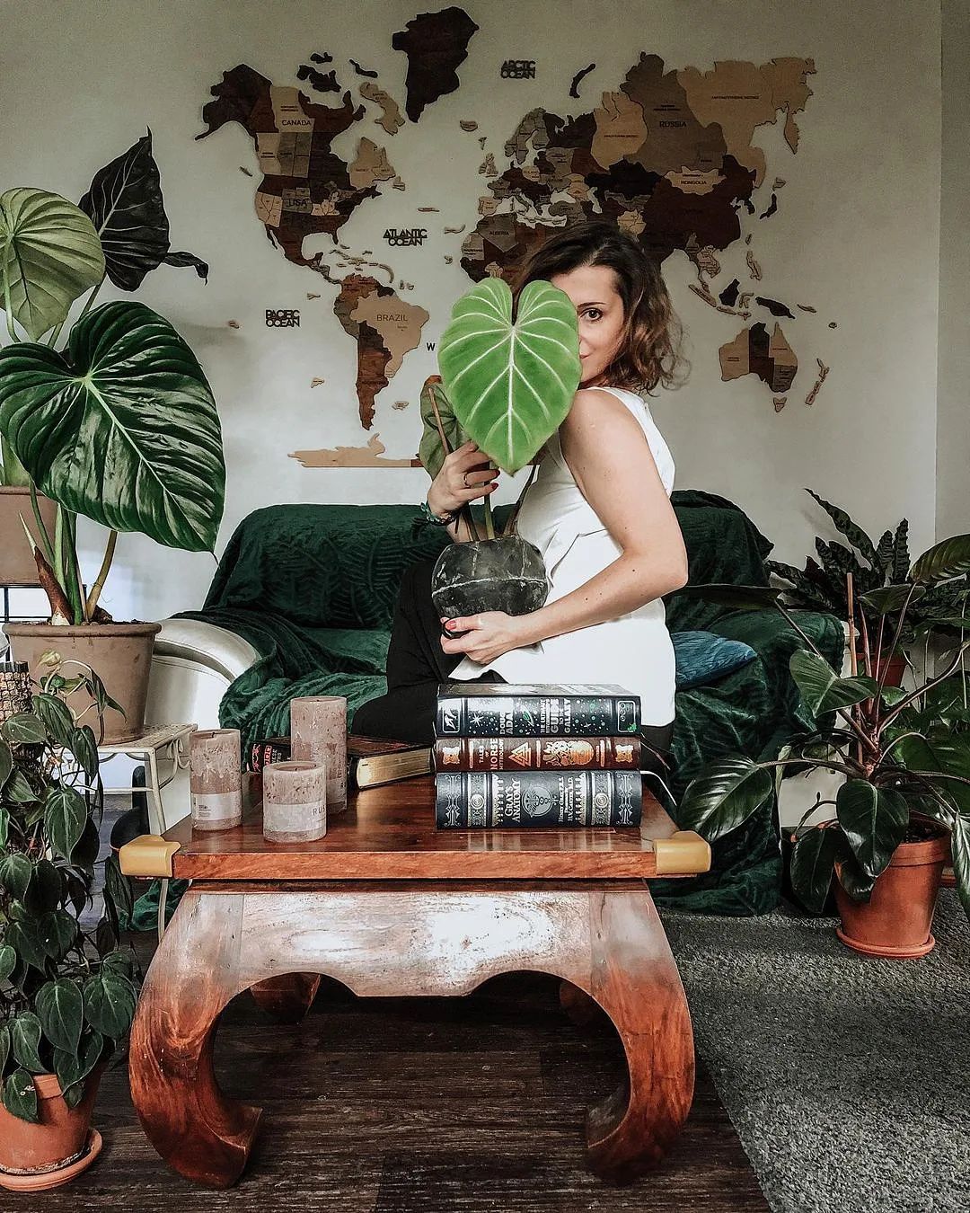 The Philodendron Gloriosum is a True Houseplant Gem woman posing with a philodendron gloriosum pot