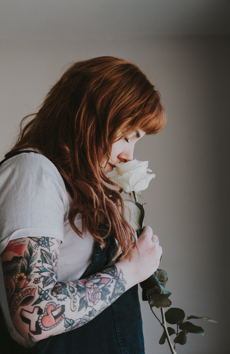 woman smelling rose smelling a single rose is flower magic