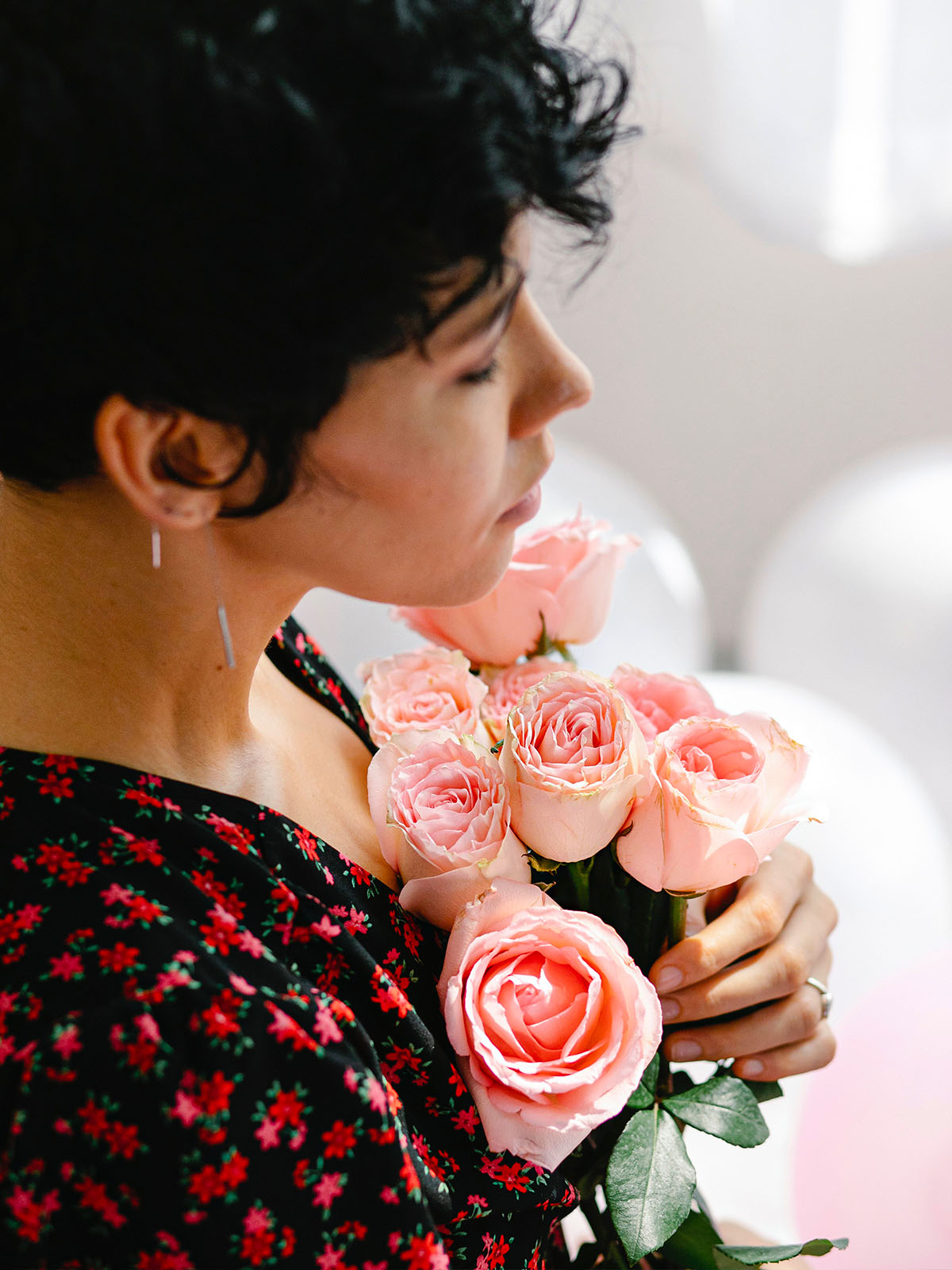 Black haired girl with roses on Thursd