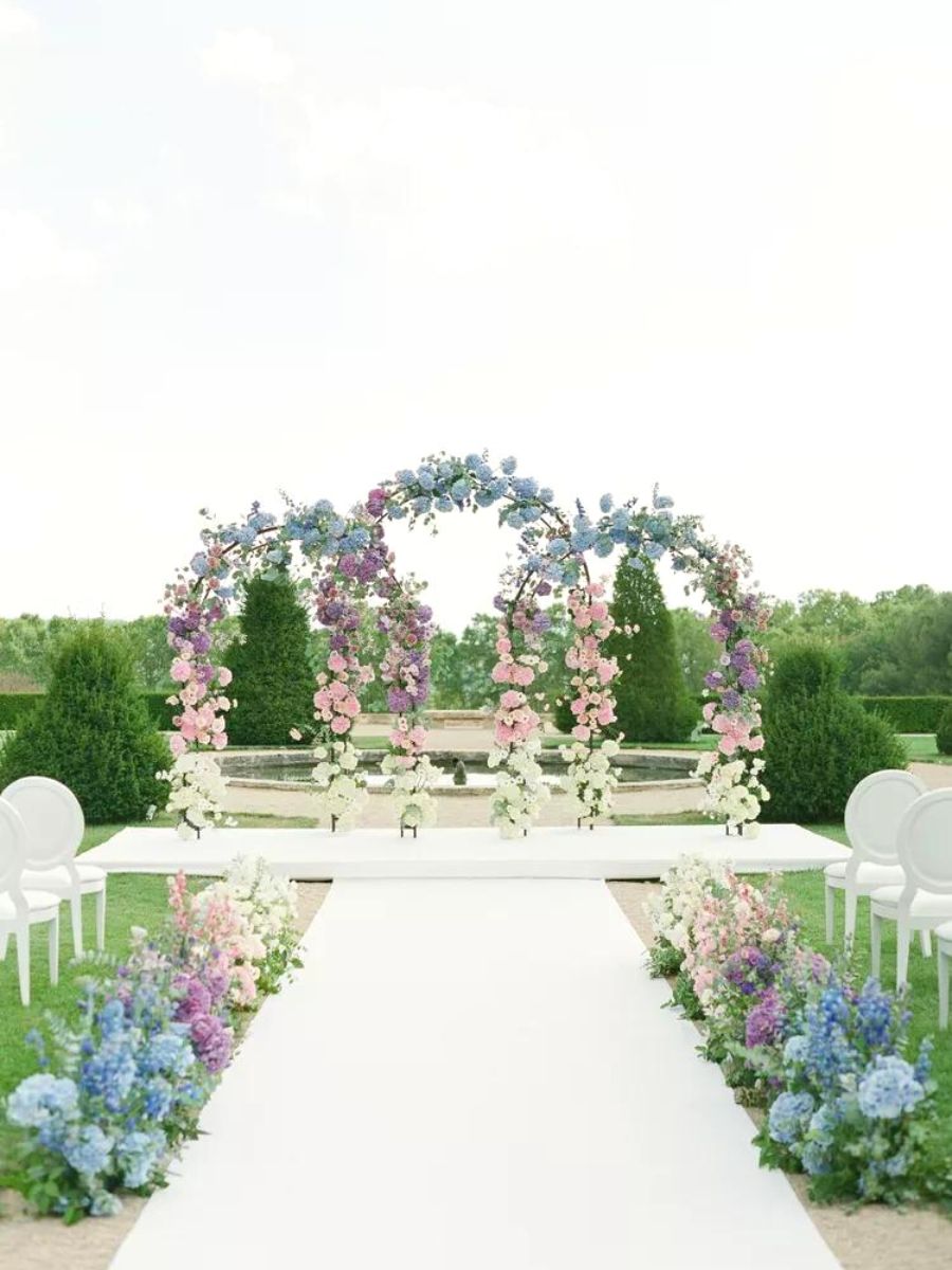 Aisles at weddings full of colorful flowers