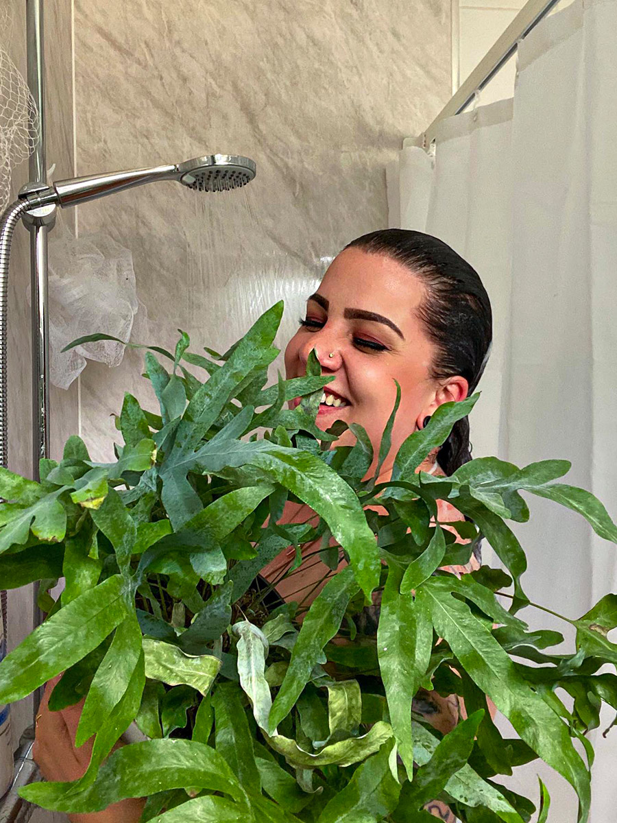 Girl with plants in the shower Girl with plants in the shower