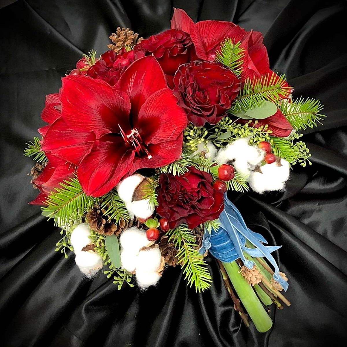 Amaryllis for the Christmas Season Bright red amaryllis in a christmas bouquet