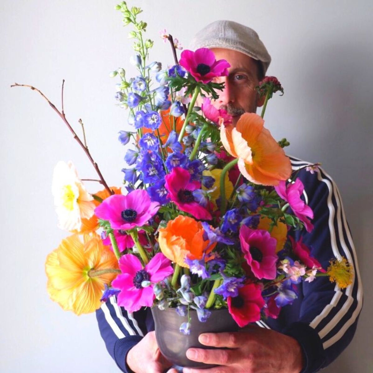 Florist TJ McGrath with colorful flowers