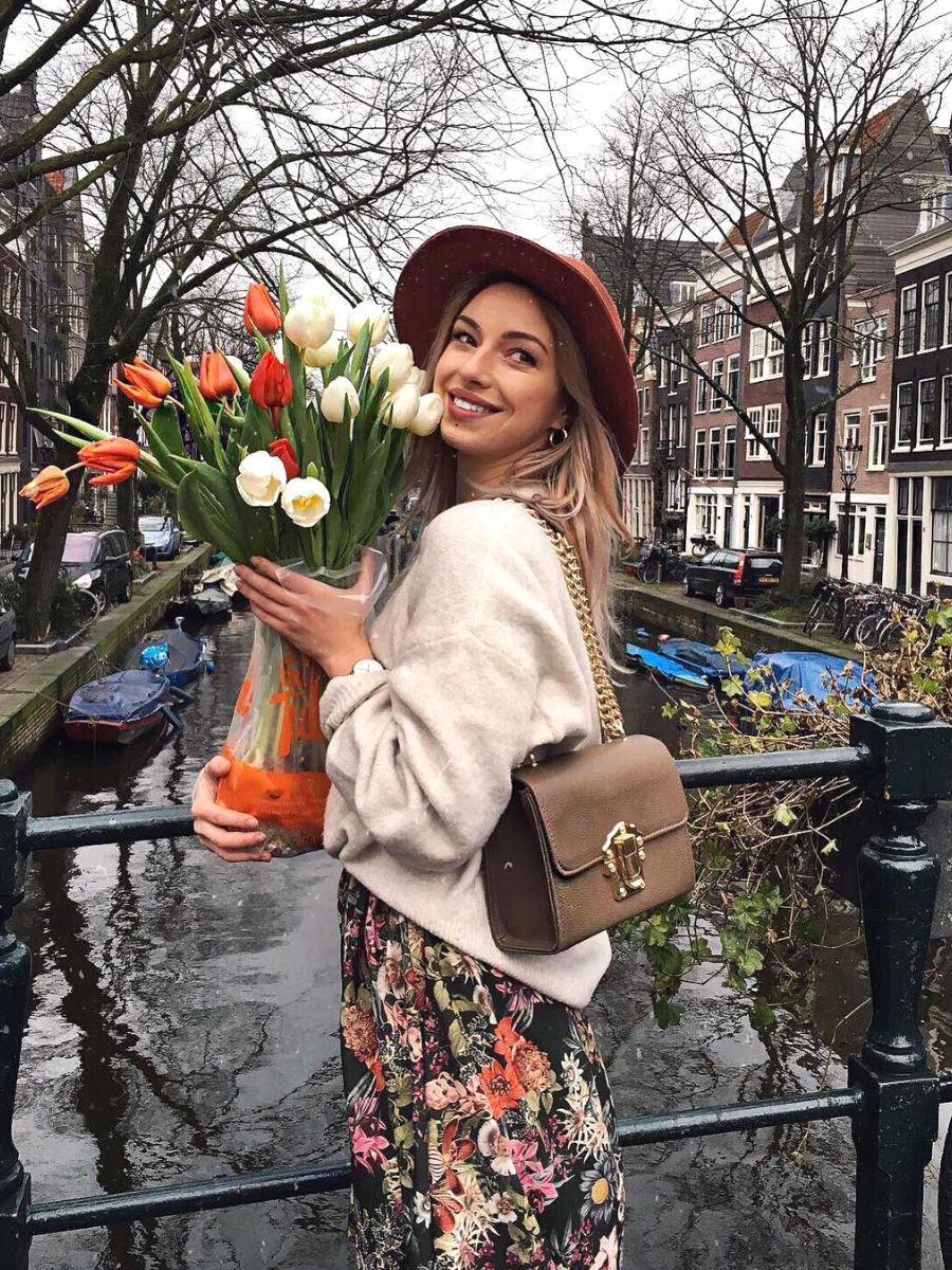 Girl with tulips in an Amsterdam canal Girl with tulips in an Amsterdam canal