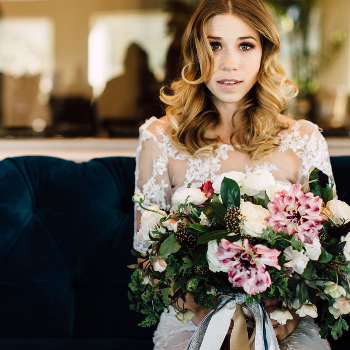 A wedding bouquet with pink Charlotte ranunculus