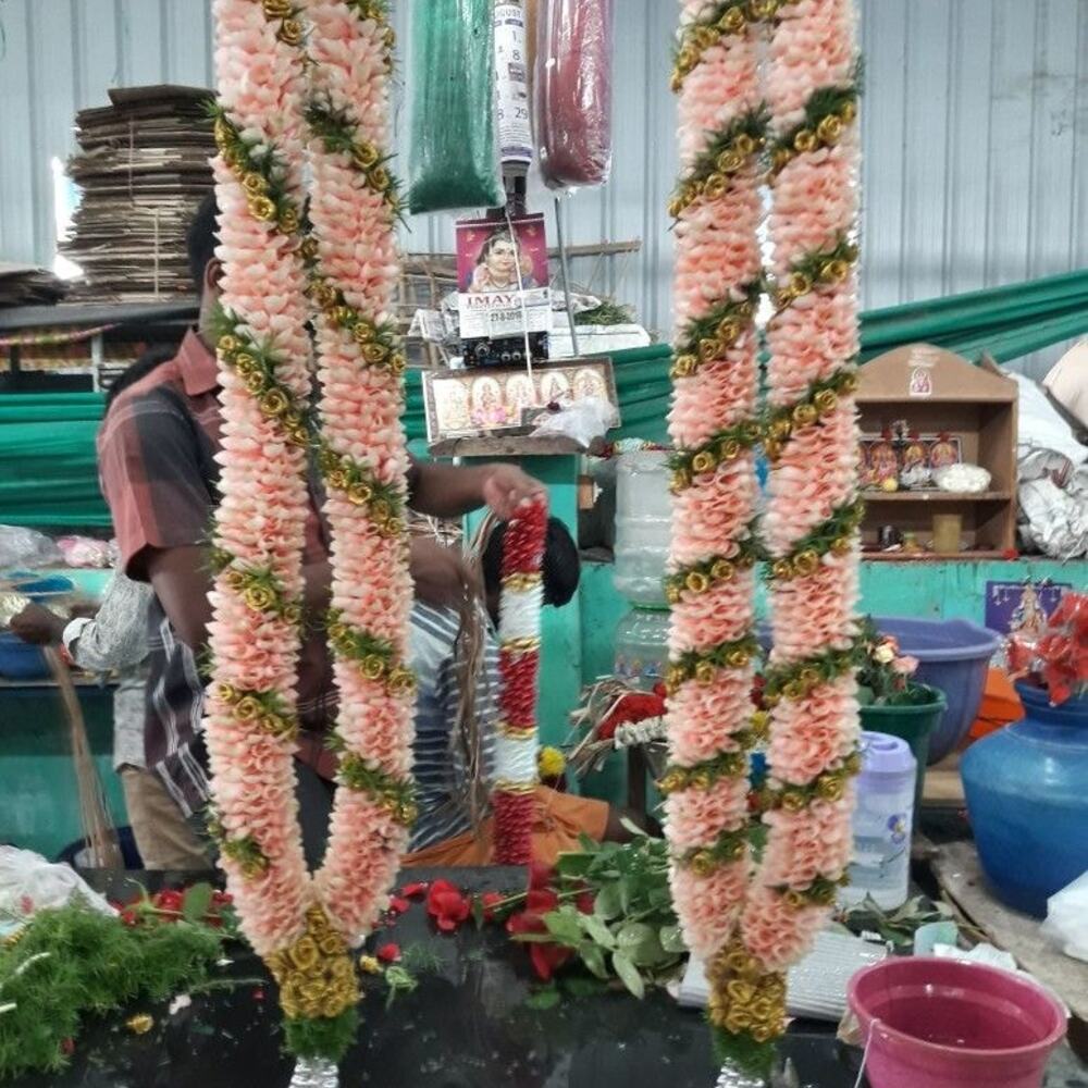 different varieties of indian wedding garlands or varmala being made in a flower shop in India varmala being made in a flower shop