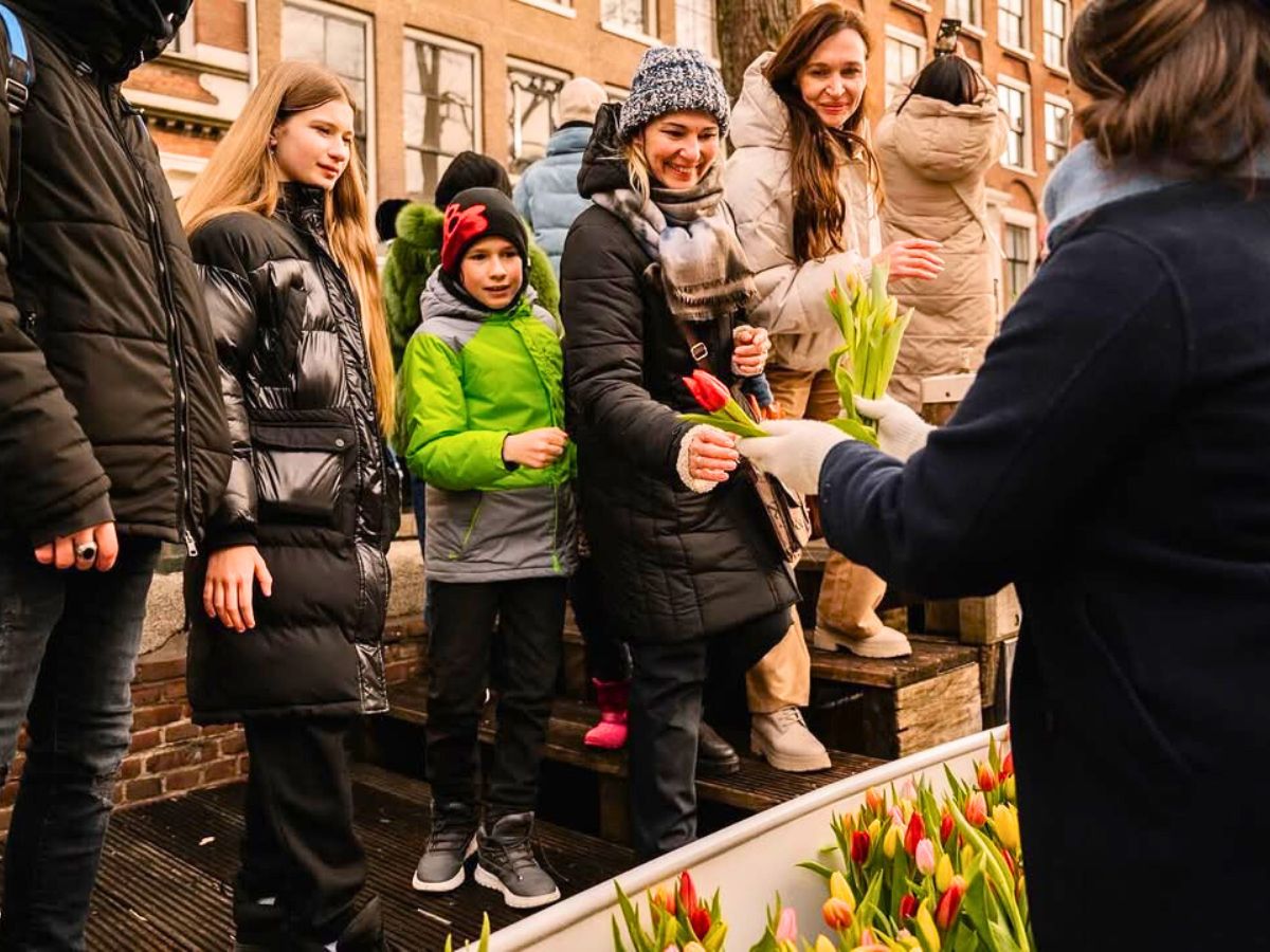 Handing out tulips to people in Amsterdam Handing out tulips to people in Amsterdam
