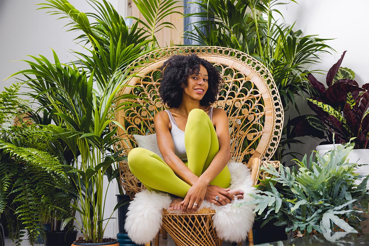 Air So Pure plants with model in big chair Air So Pure plants with model in big chair